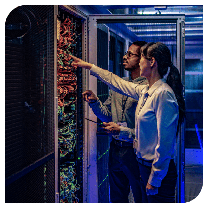 Two colleagues looking at a server system