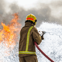 Back of firefighter in action