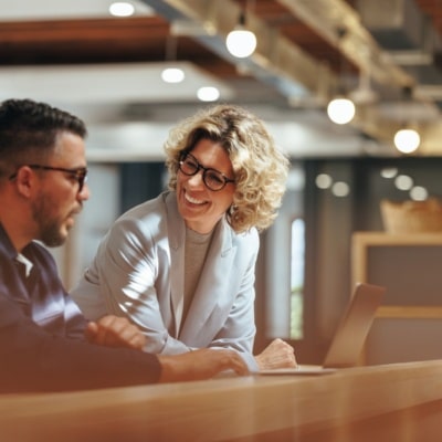 Two business professionals working together