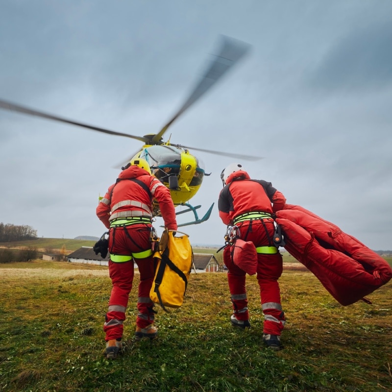 Two paramedic with safety harness and climbing equipment