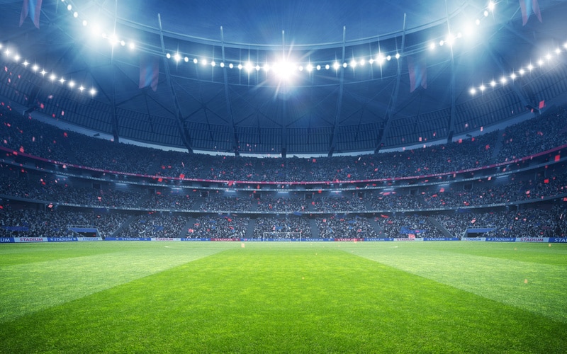 Football Stadium Under the Spotlights with Cheerful Atmosphere