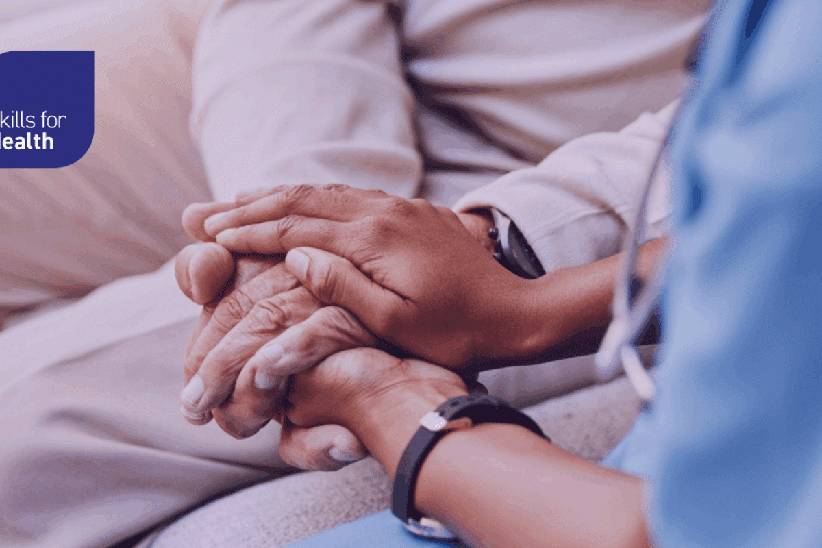 medical worker holding patient's hands comforting them