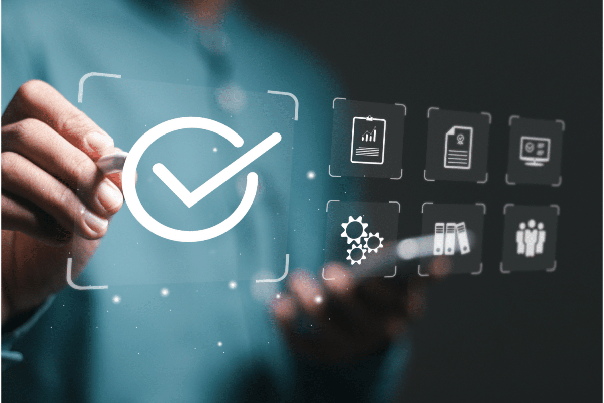 Business person use pen touching symbol of the top service Quality assurance on interface screen.