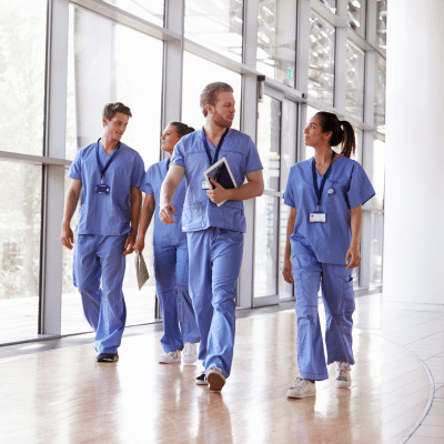 A group of healthcare workers walking together in a hospital setting