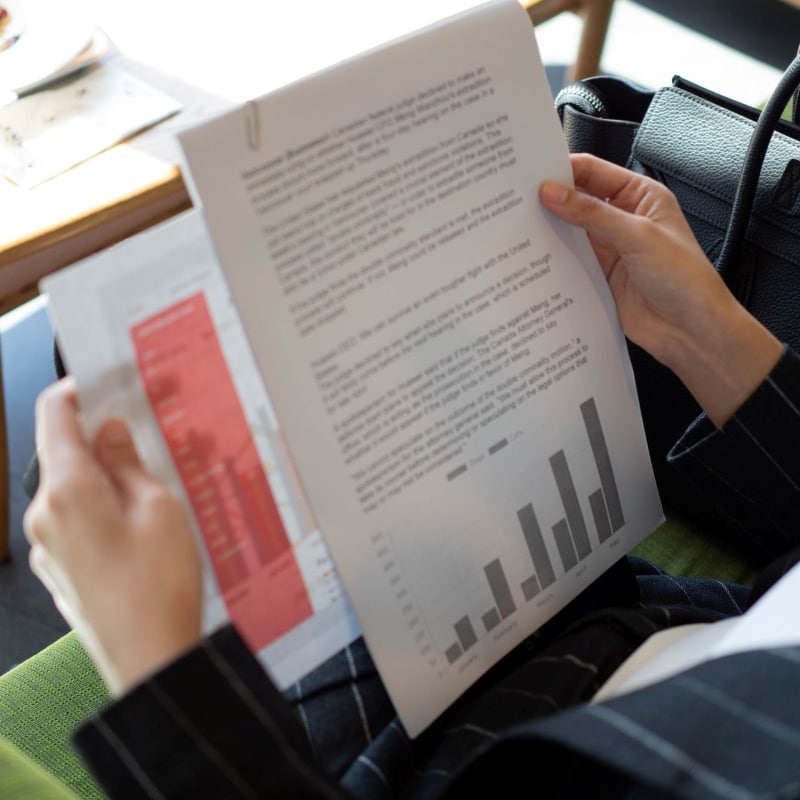 Someone sat reviewing documents in an office